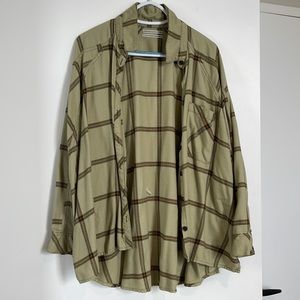 Green with brown and yellow flannel. Button up front